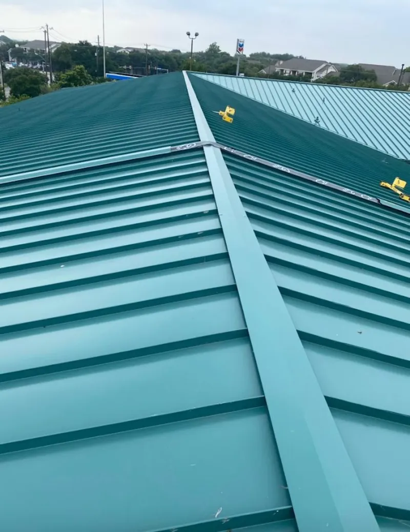Green commercial metal roof ridge and valley for Metal Roof Repair in Atkinson