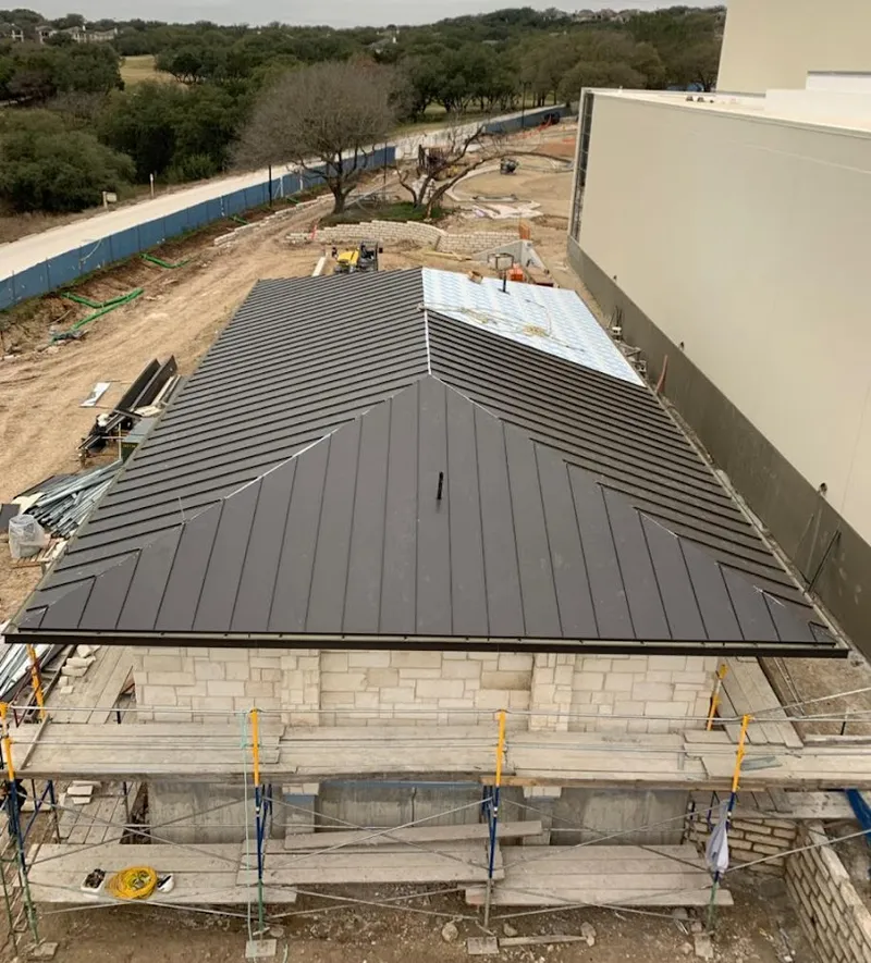 Metal roof new construction with scaffolding in Atkinson